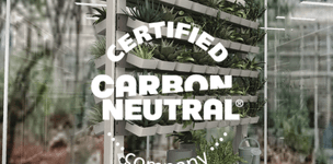 carbon neutral certification logo displayed over Symbiote UltraFrame mobile cart with hanging subcontainers filled with plants
