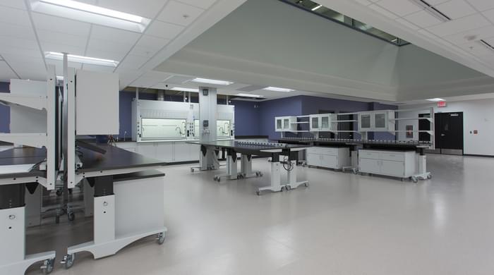 height adjustable Symbiote ErgoStats with stainless steel surfaces, mobile lab cabinets, plug strips in Amway Chemistry Lab